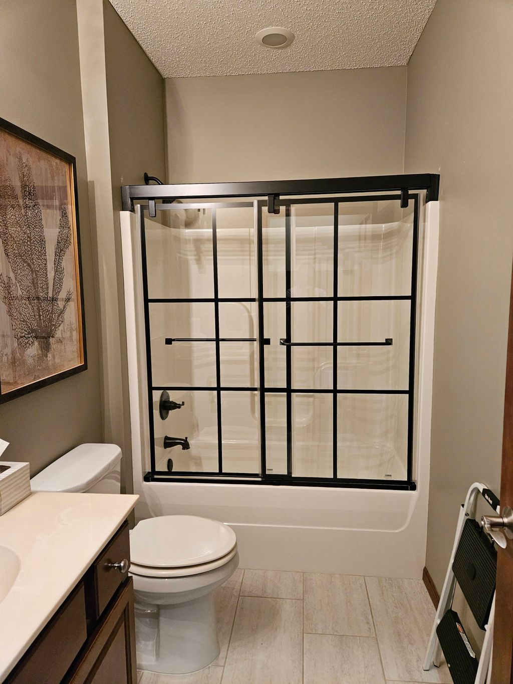 Replaced standard shower curtain with glass barn d