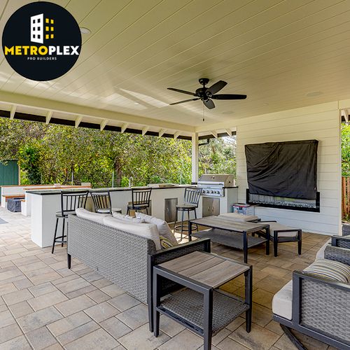 Backyard patio enclosure with bar, electrical, and