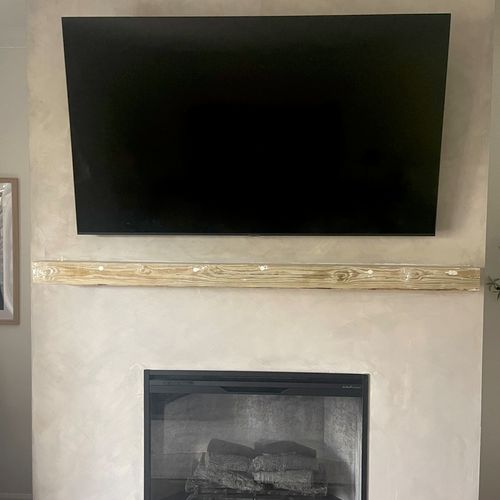 Tony installed a fireplace surround and an electri