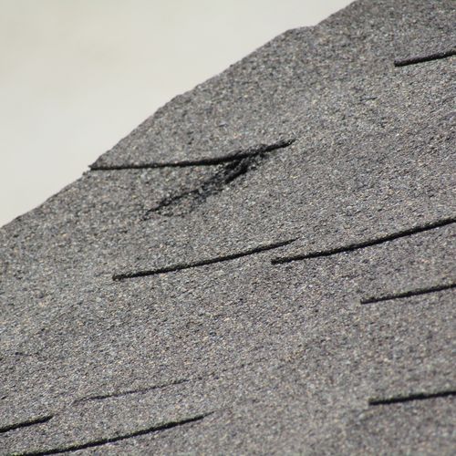 Hail damage on an asphalt shingle roof 