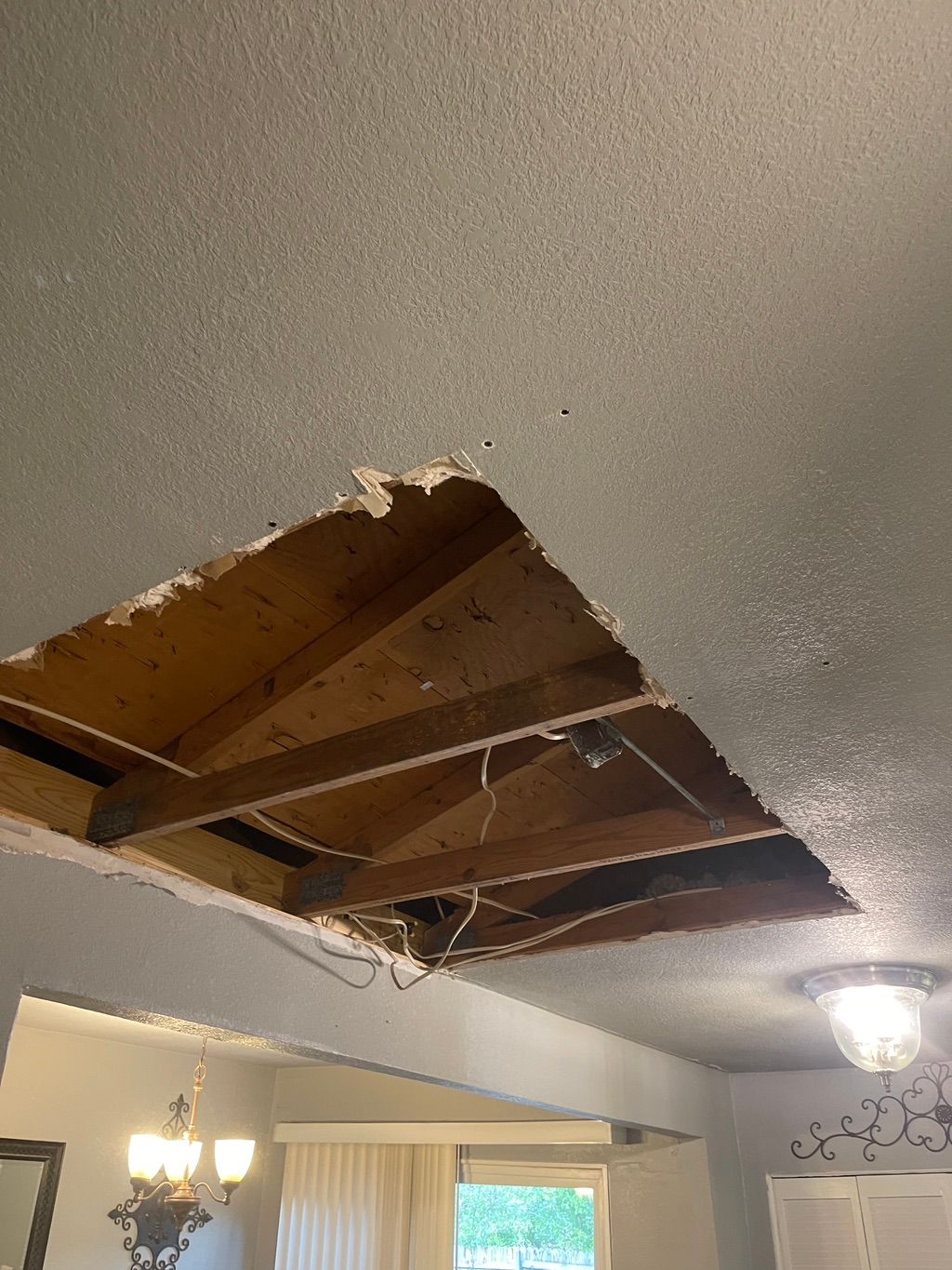 Water leaked from the Roof, causing Sheetrock dama