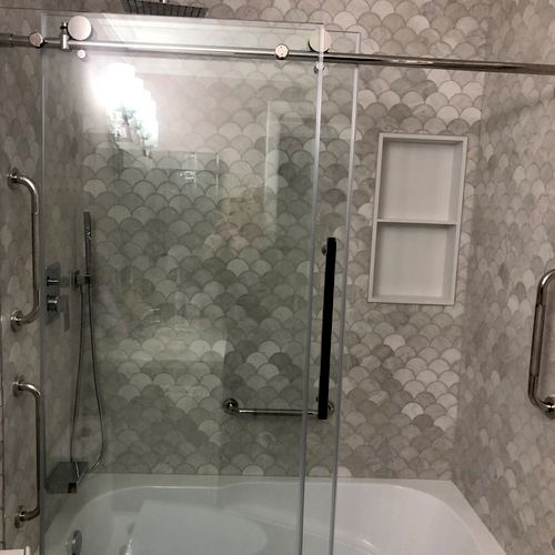 Roman installed a frameless shower door system wit