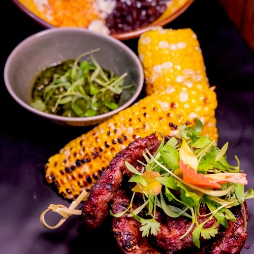 Mexican Plated dinner; 
Grilled skirt steaks -Rice