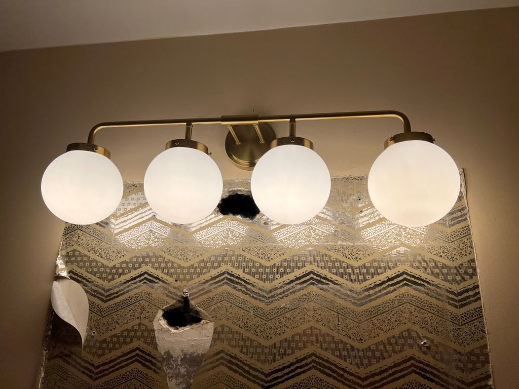 Remove bathroom mirror and installed vanity light 