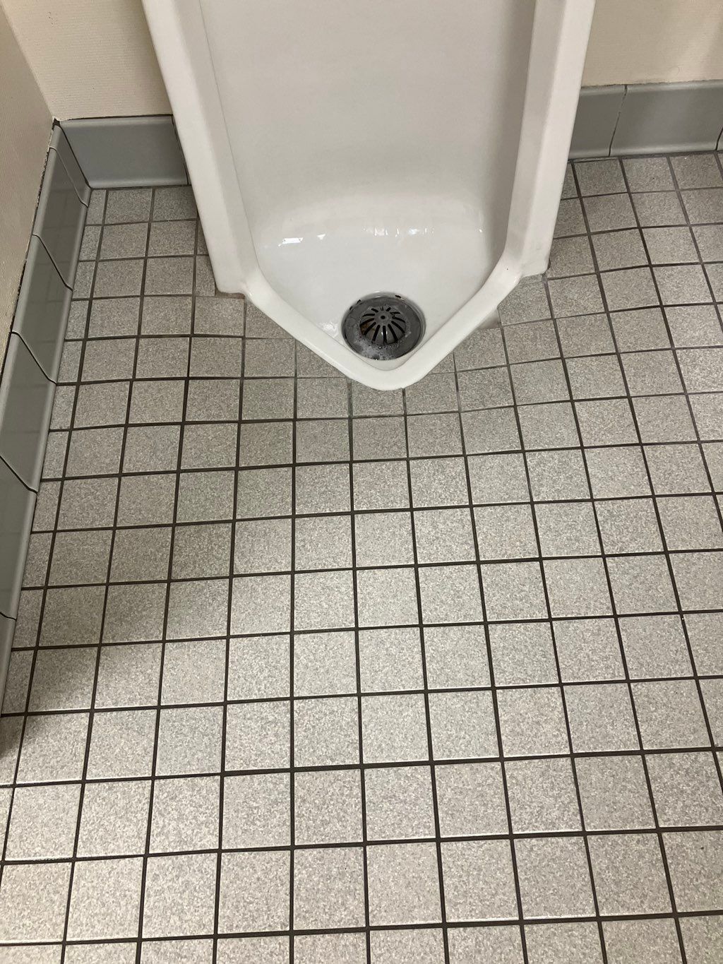 After - men’s urinal stall. during deep cleaning p