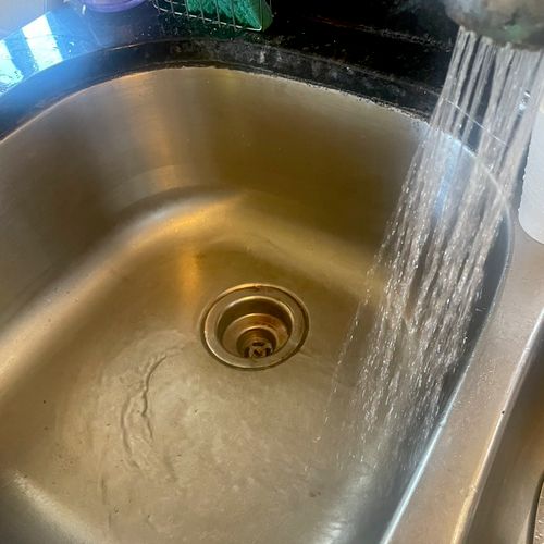 Unclogged kitchen sink with hydro jet due to greas