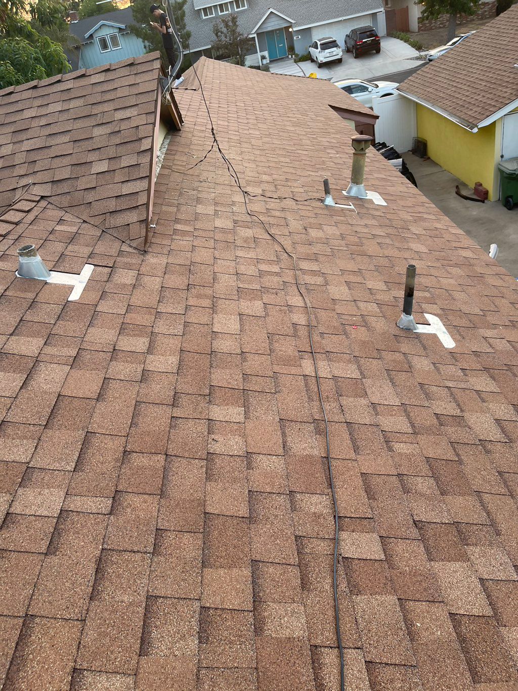 This is the new roof , new CDX-wood base sheet fel