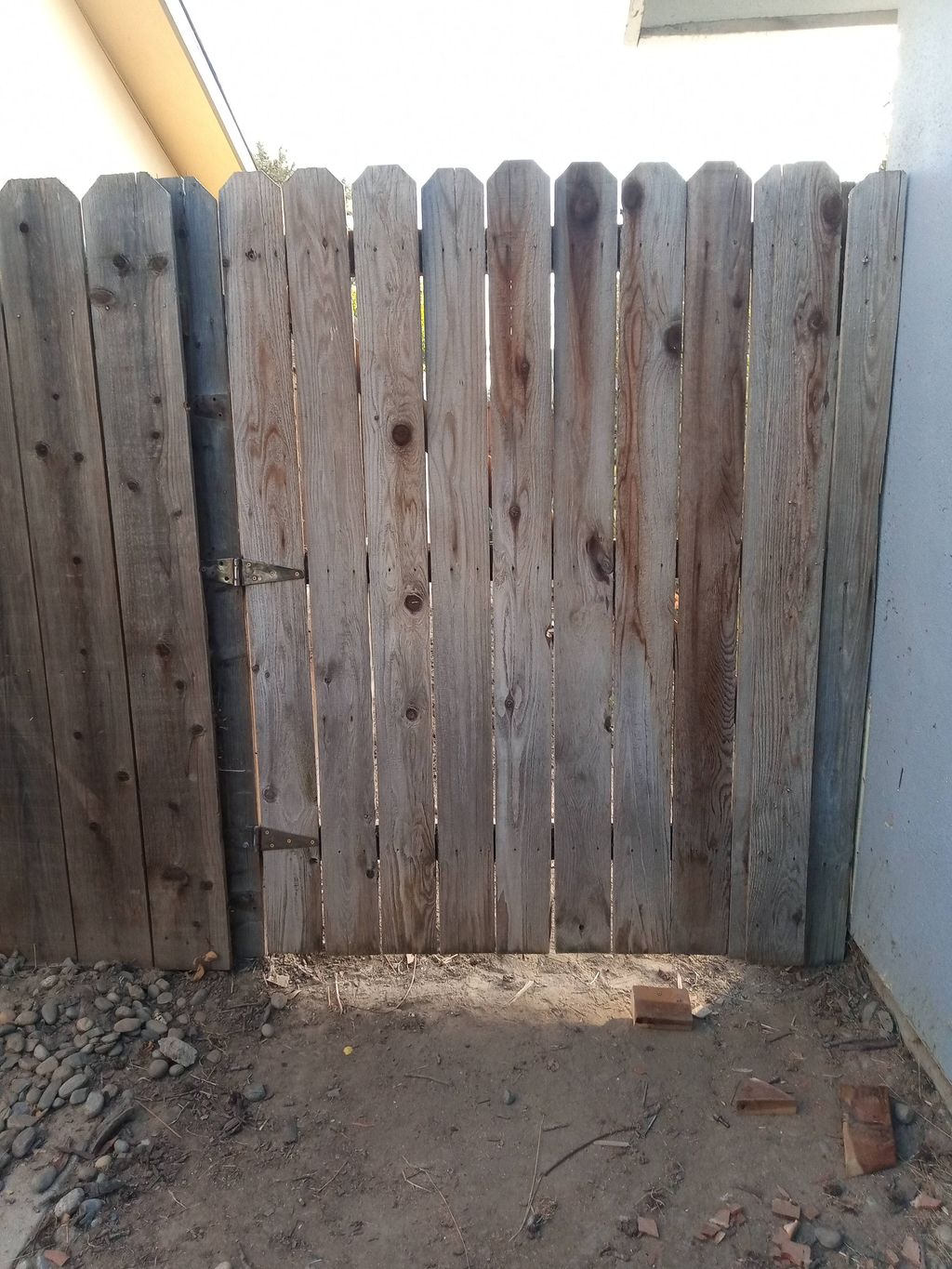 rebuilt fence with existing materials 