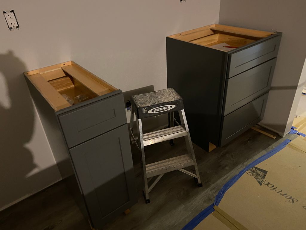 Install kitchen cabinets 