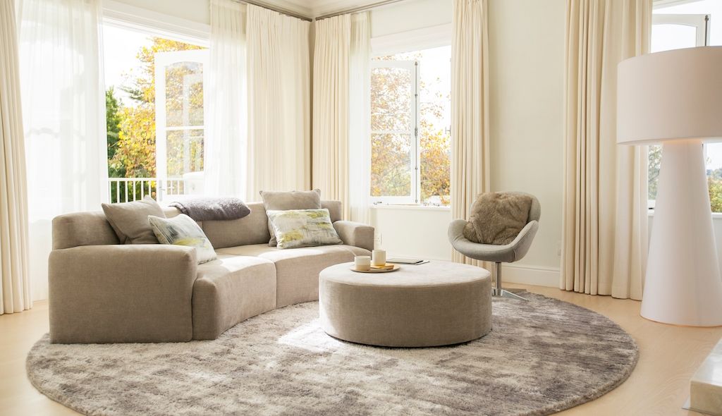 living room with round rugs and furnishings