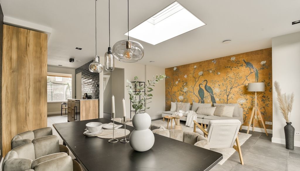dining room with large mural of birds in trees