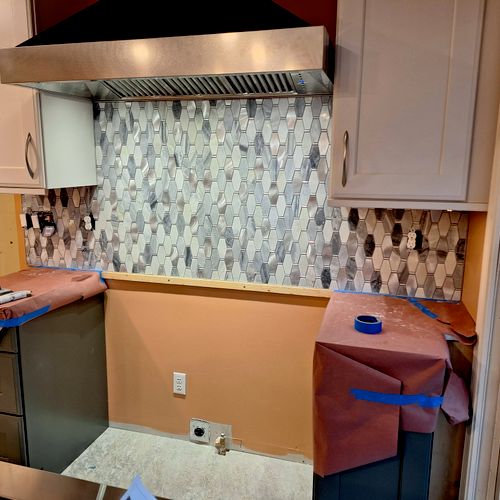 New tile, cabinets and vent hood 