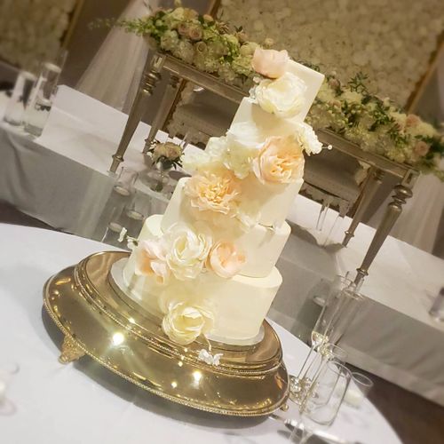 Faux cake with blush colored artificial flowers