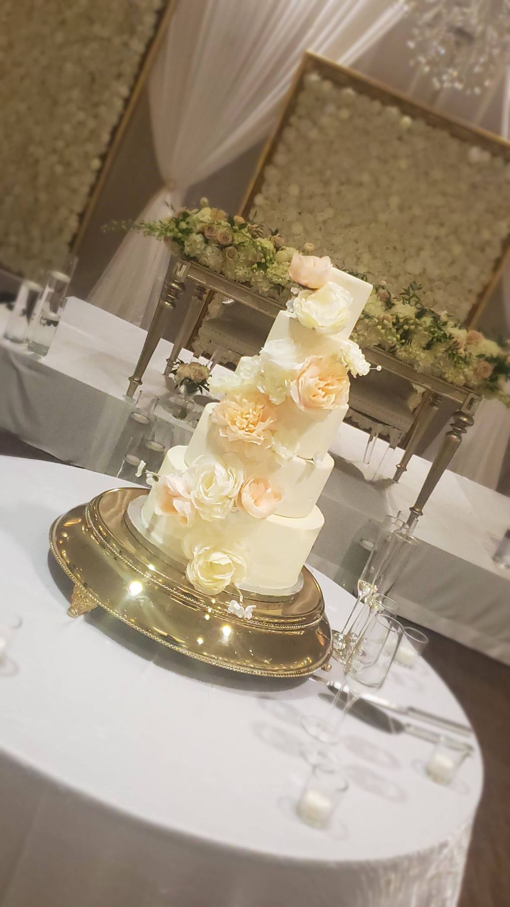 Faux cake with blush colored artificial flowers