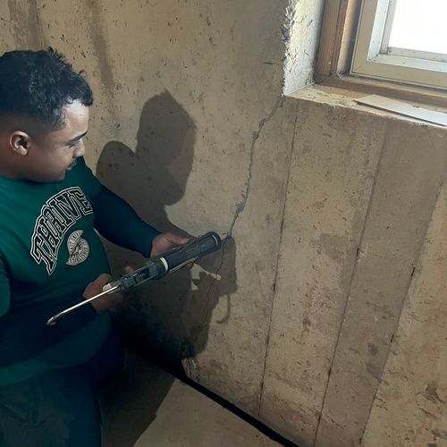 Sealing concrete wall cracks in basement