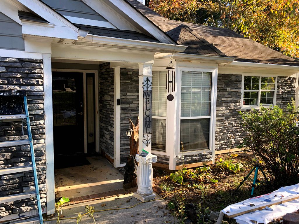 Stone facing entire front of house and chimney