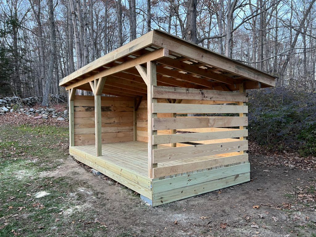 Shed with open side for air flow to help dry firew