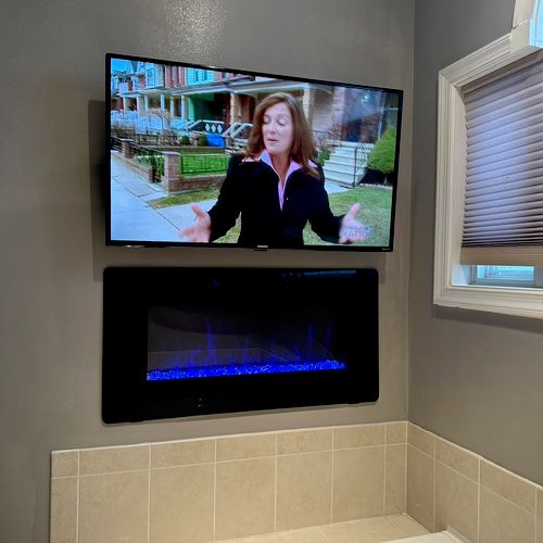 Beautiful electric in wall fireplace and tv instal