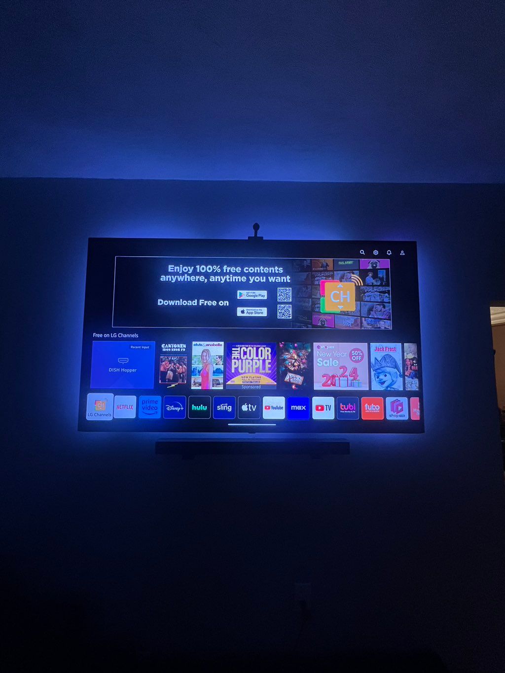 Hung tv with govee led lights and sound bar 