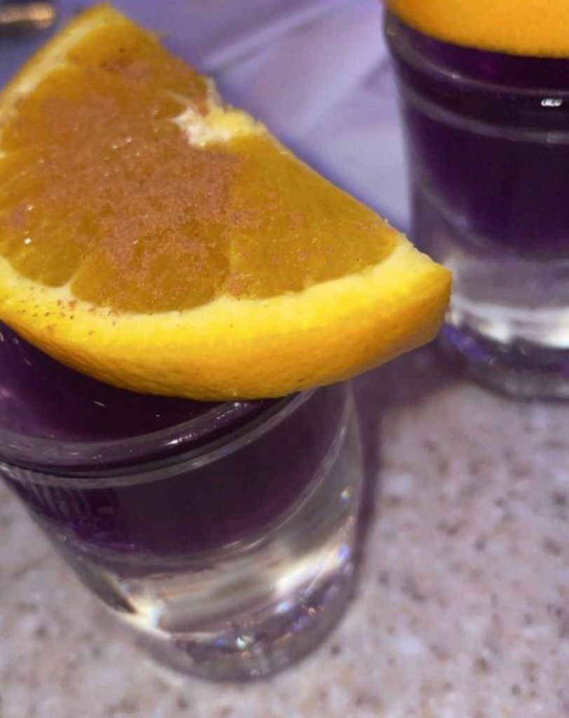 Purple shots with a Cinnamon orange slice