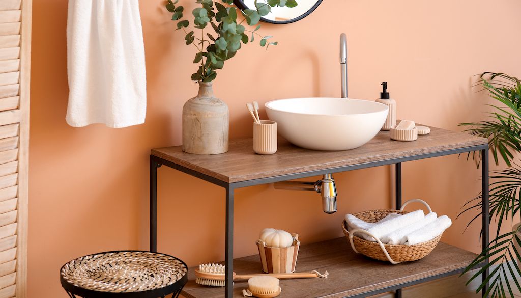 peach color bathroom wall behind sink