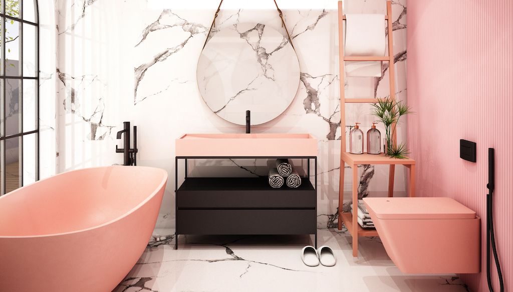 bathroom with light pink wall, pink tub, and marble wall and marble floors