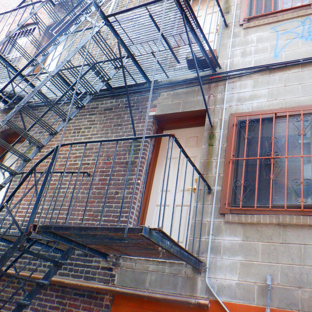 South End   The rear wall of a fire damaged buildi