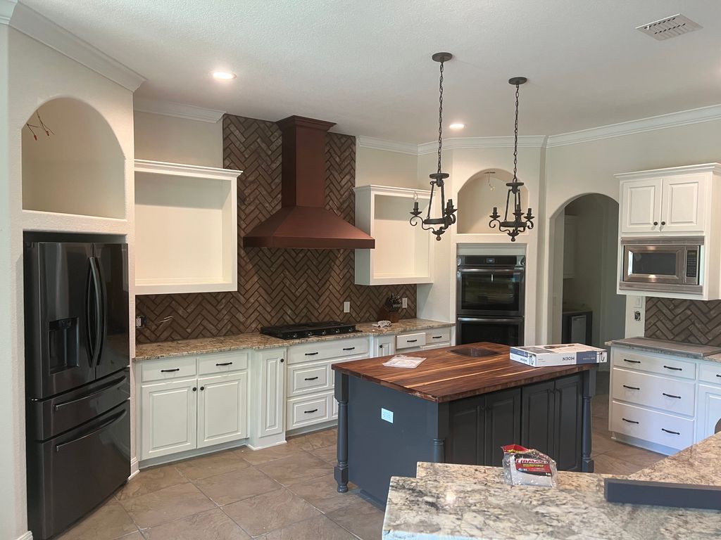 Kitchen cabinets, island, walls & trim painted 