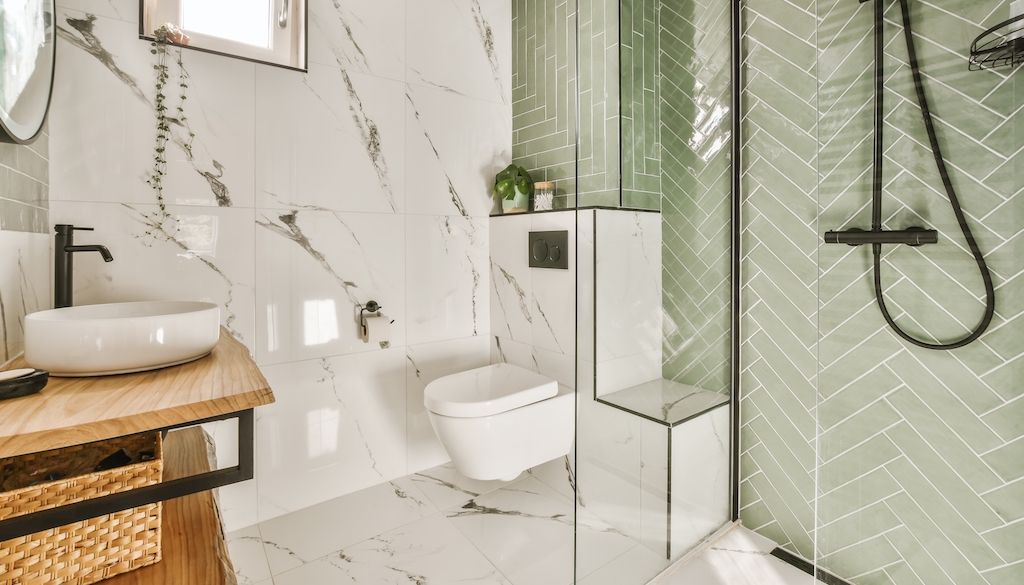 green bathroom with green shower tiles