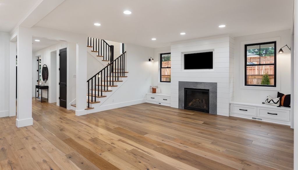 empty farmhouse living room with hardwood floors