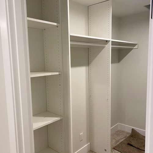 Closet shelves and clothes hangers in Sherwood. 