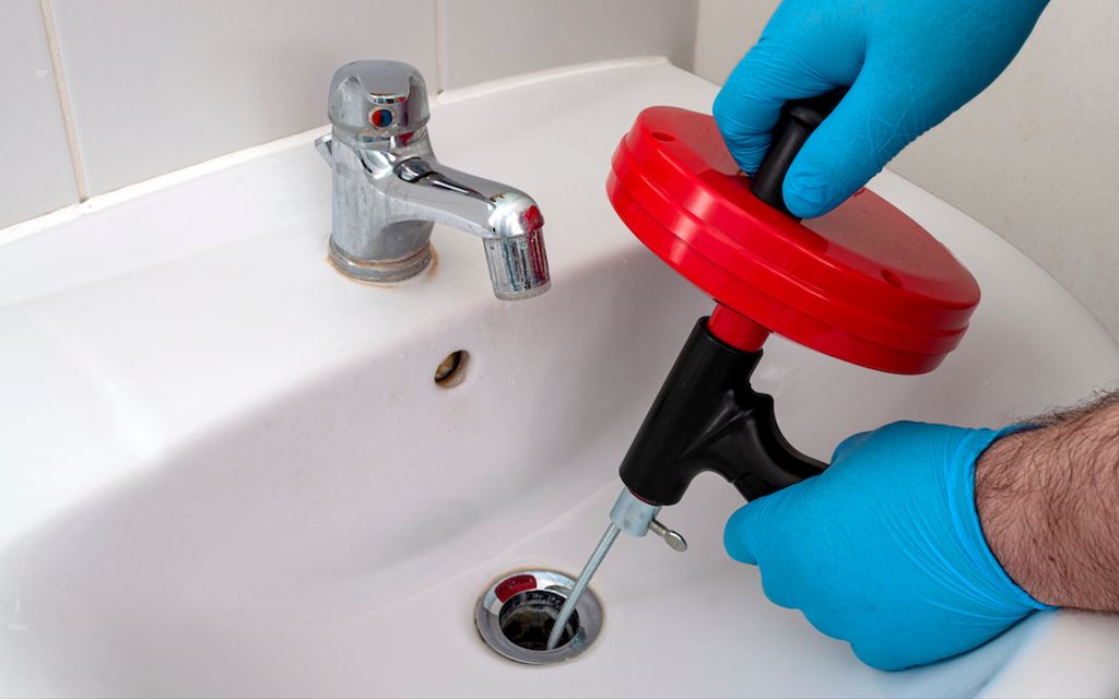 Here's the correct way to use a plumbing snake.