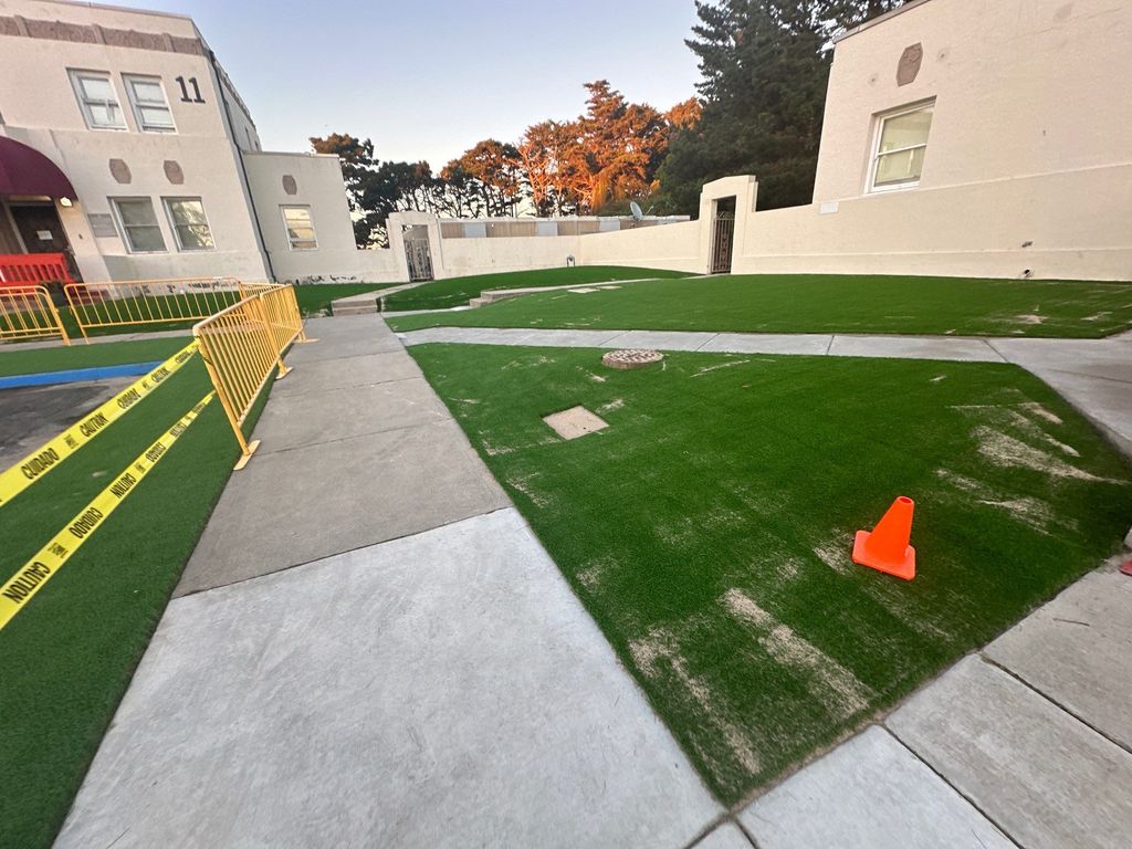 installation of artificial turf before brushing th