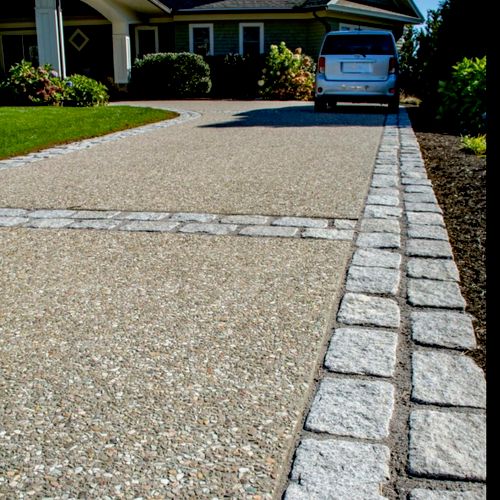 Exposed Aggregate Concrete Driveway with paver bor