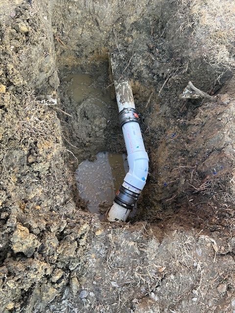 Sewer line repaired in yard.