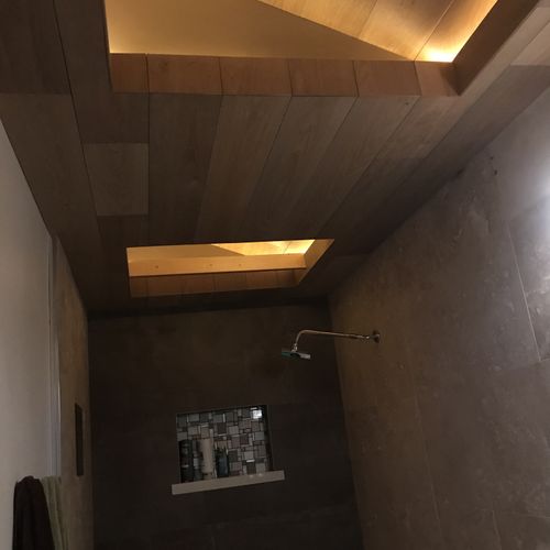 Wood ceiling with lighted recess.