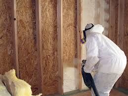 Insulating a wall.