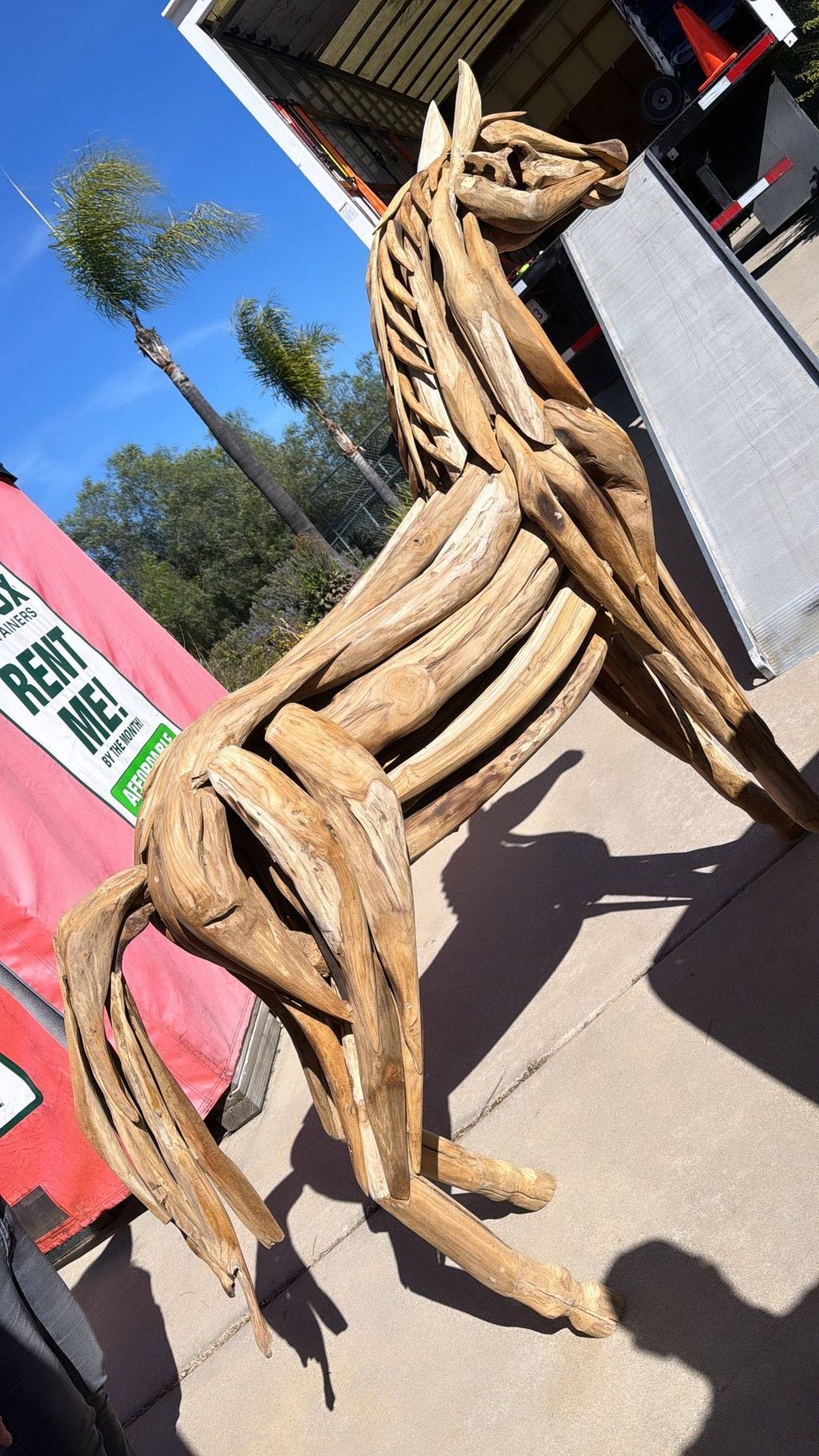 Moving a live size horse made of wood.