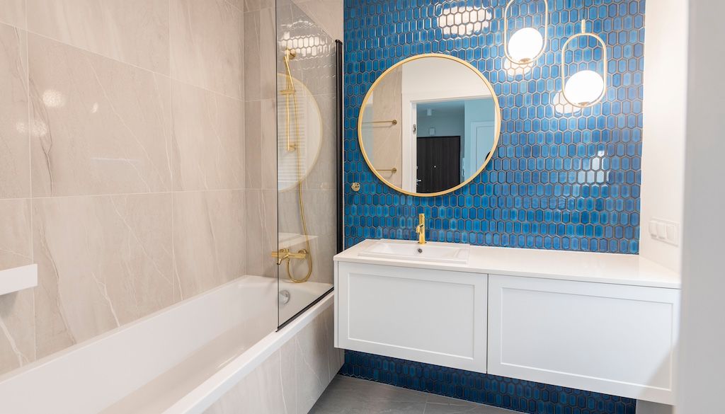 bathroom with blue tile wall