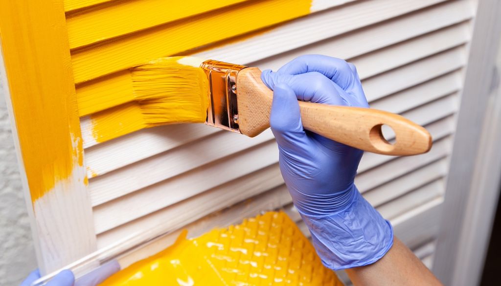 hand painting shutters yellow