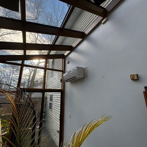 Replacement of a mini split head in a sun room.