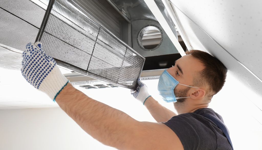 technician cleaning home's air duct; duct cleaning price, duct cleaning prices; air duct cleaning cost