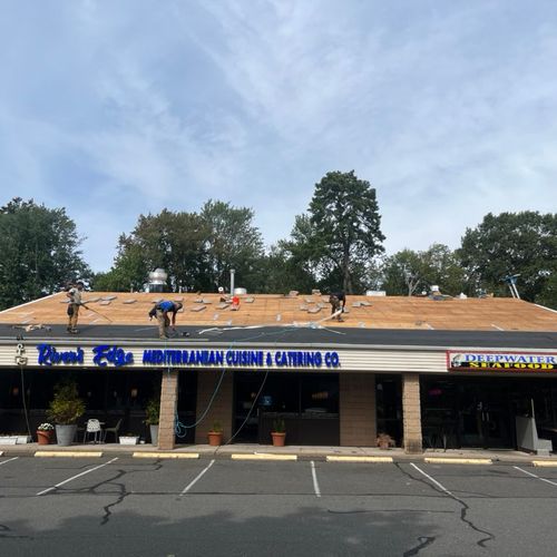 Commercial Property new shingled roof being instal