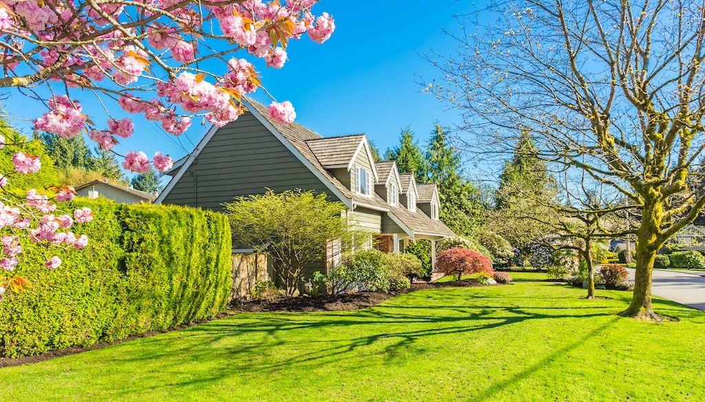 home with beautiful green spring lawn