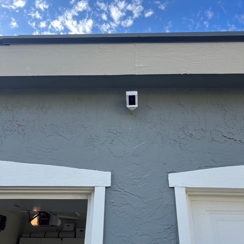 Ring spotlight camera above garage door 
