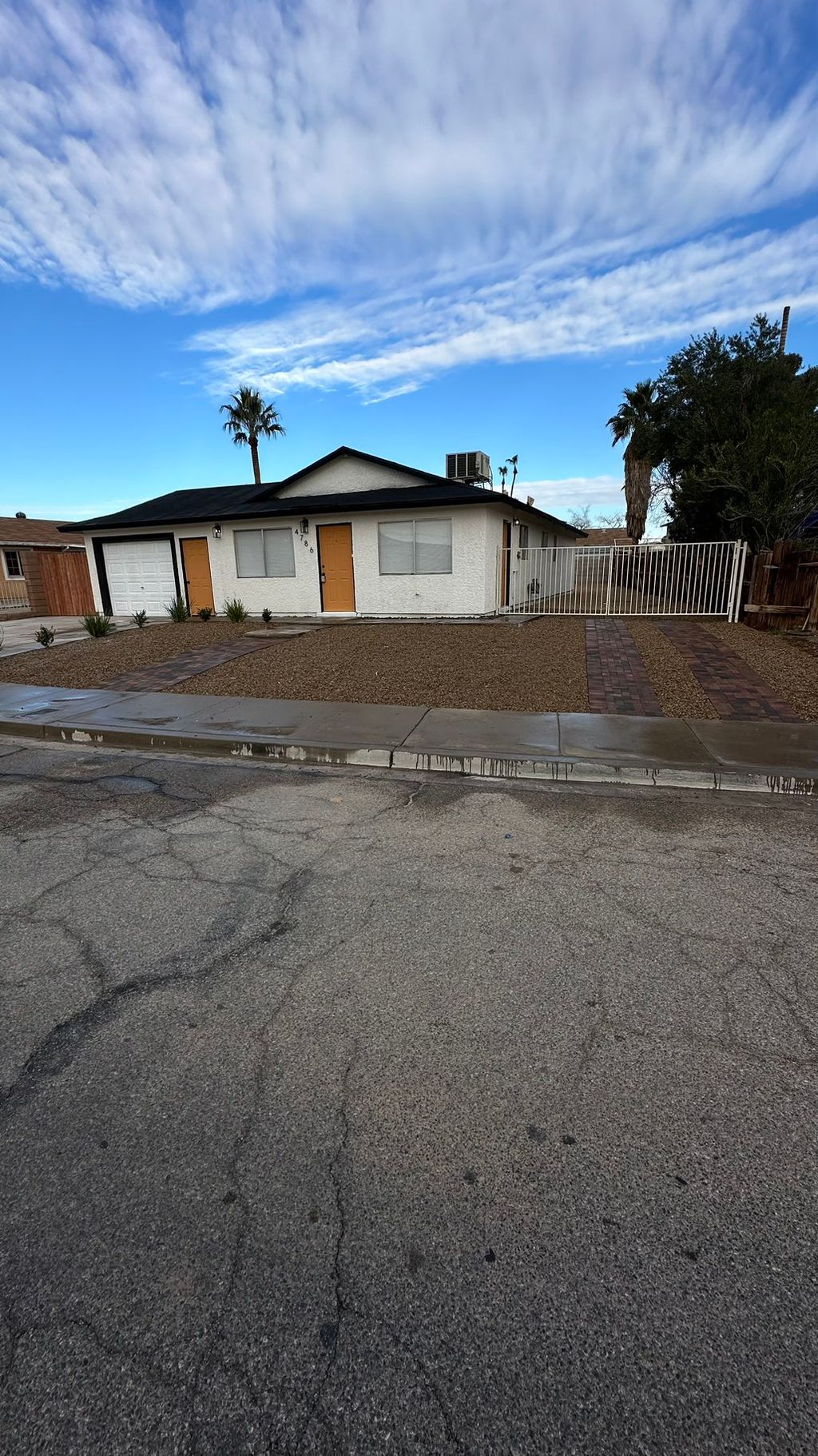 After: pavers, plants, Niw irrigation and rock 