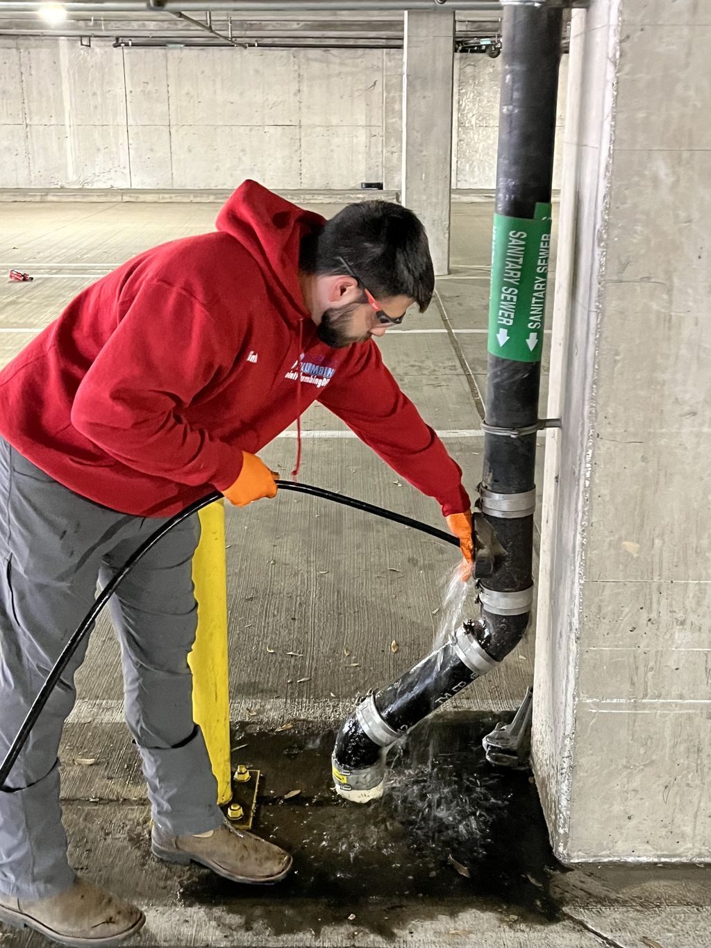 Clinton jetting out stopped up sewer line