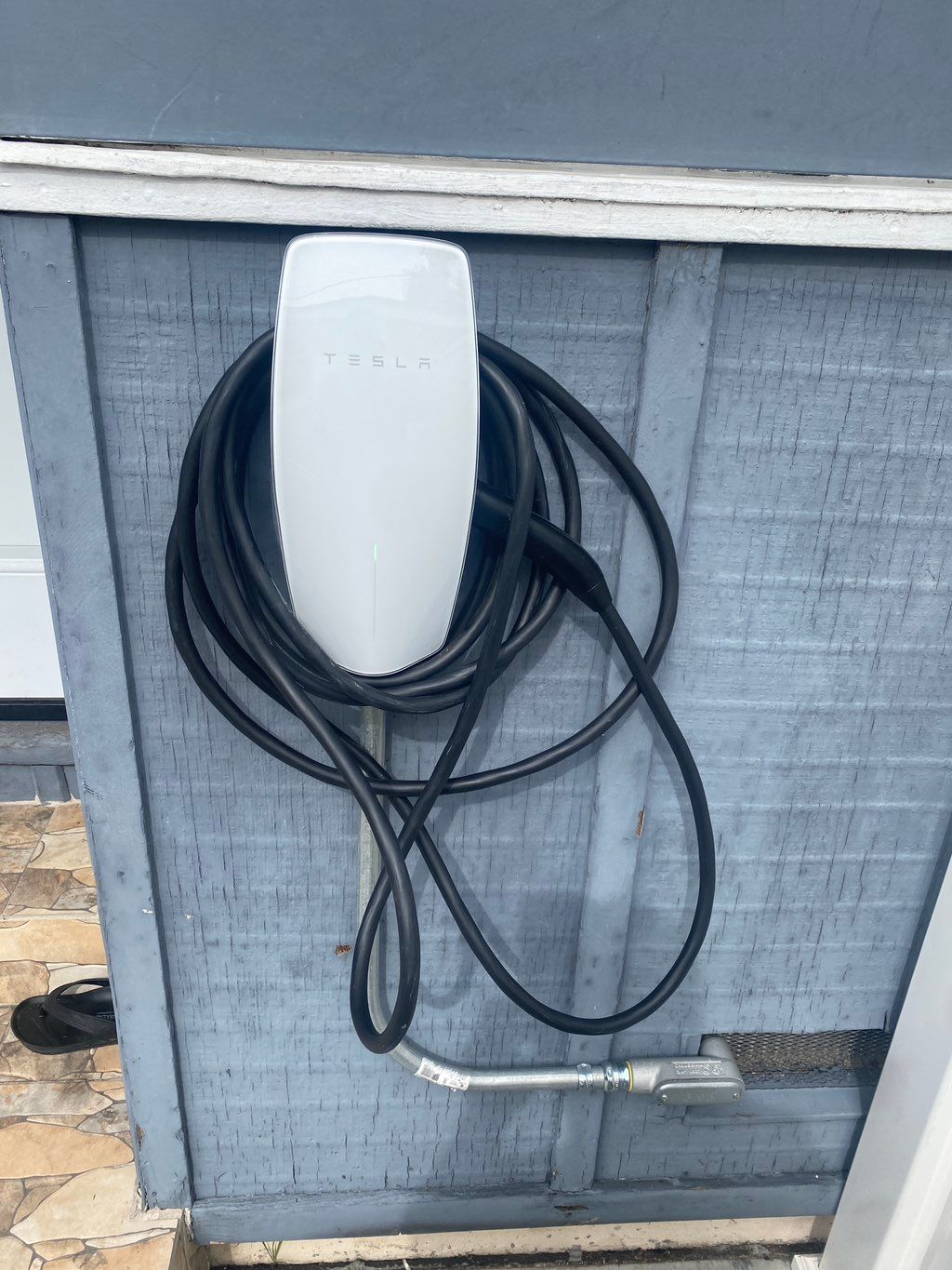 Tesla car charger installed under house to the fro