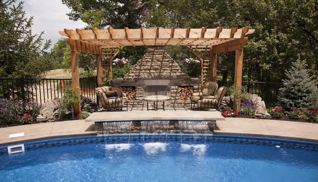 swimming pool remodeling idea: backyard swimming pool with a water feature fountain