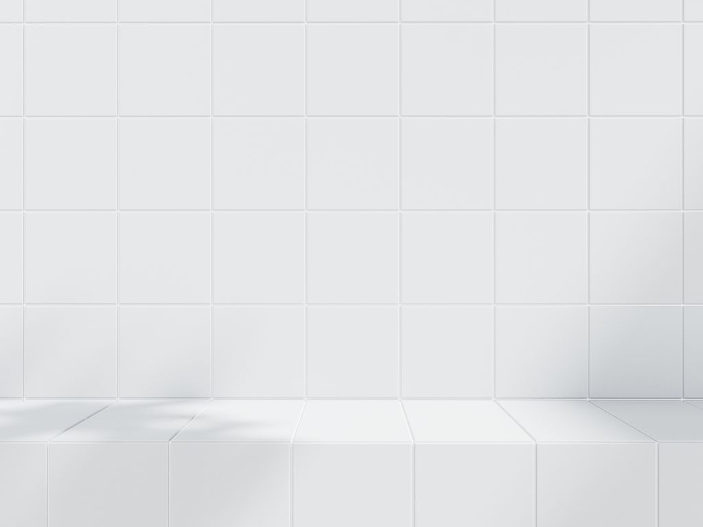 White tiled wall with a counter